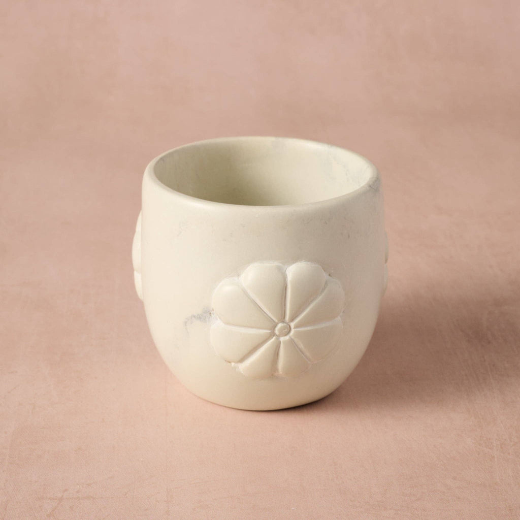 White 3.5" soapstone planter with flower design on a pink background