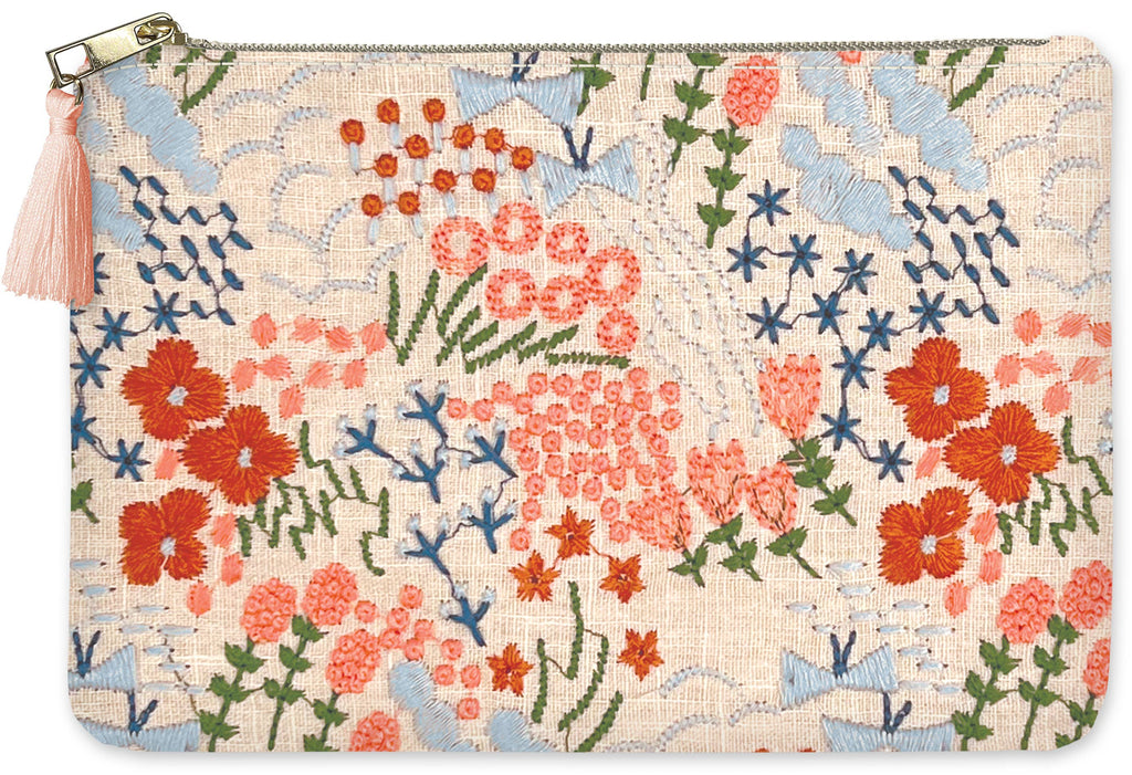 Floral patterned pouch with colorful flowers and a tassel on a beige background